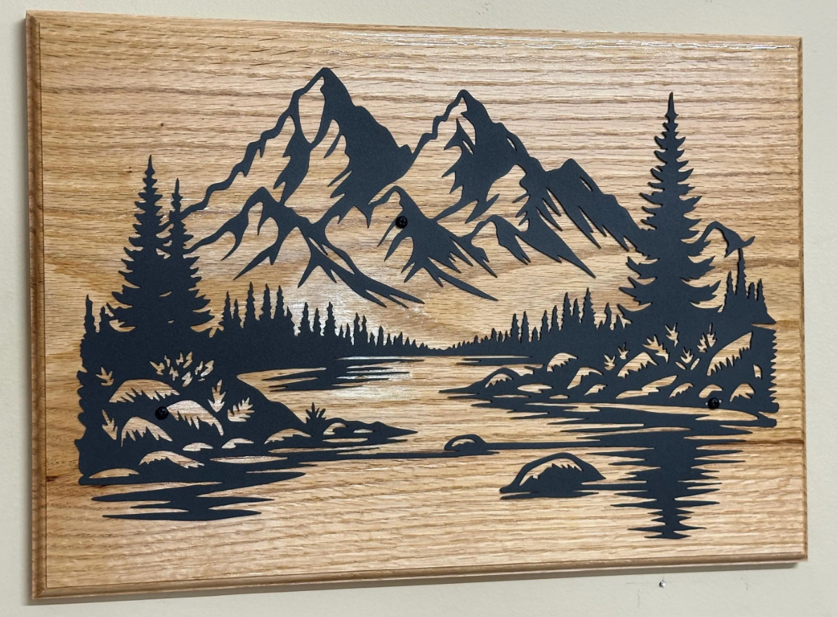 Beautiful mountains, handcrafted metal wall art, featuring a black steel landscape silhouette on solid red oak